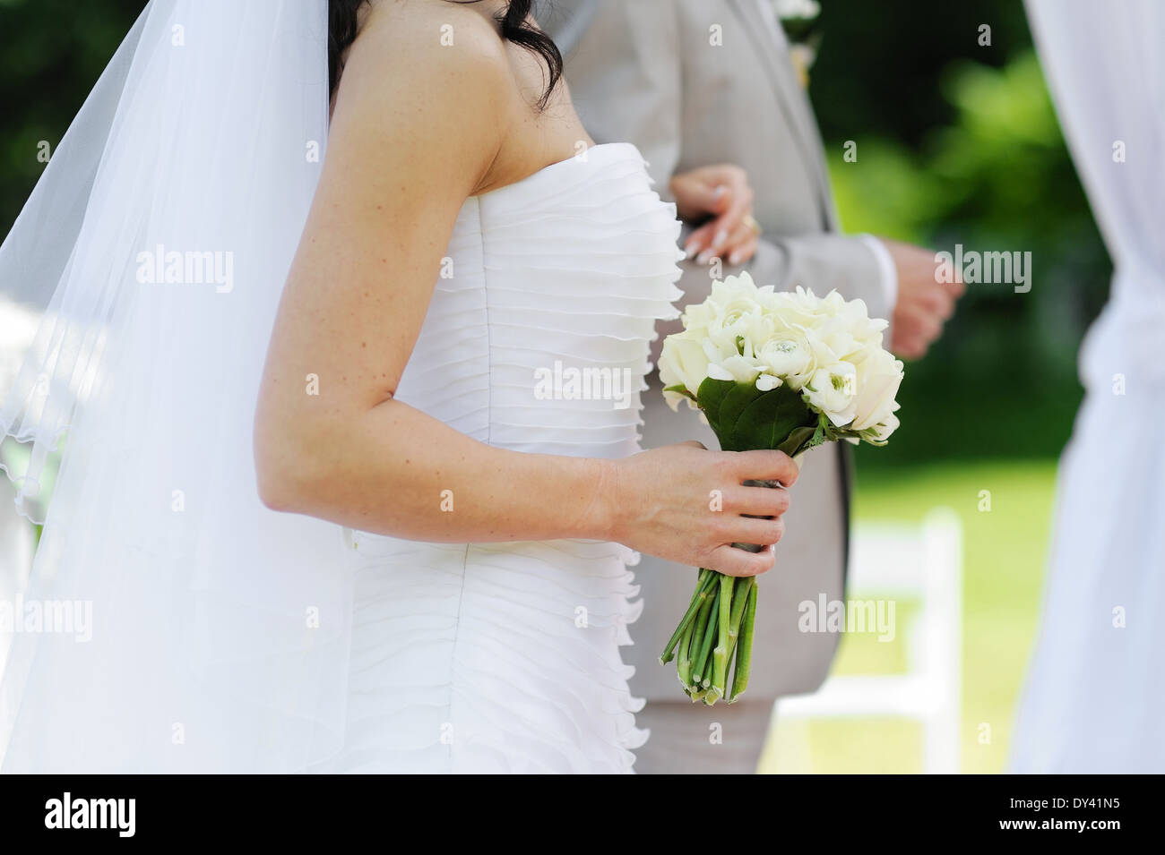 Bride holding beautiful white wedding bouquet Stock Photo - Alamy