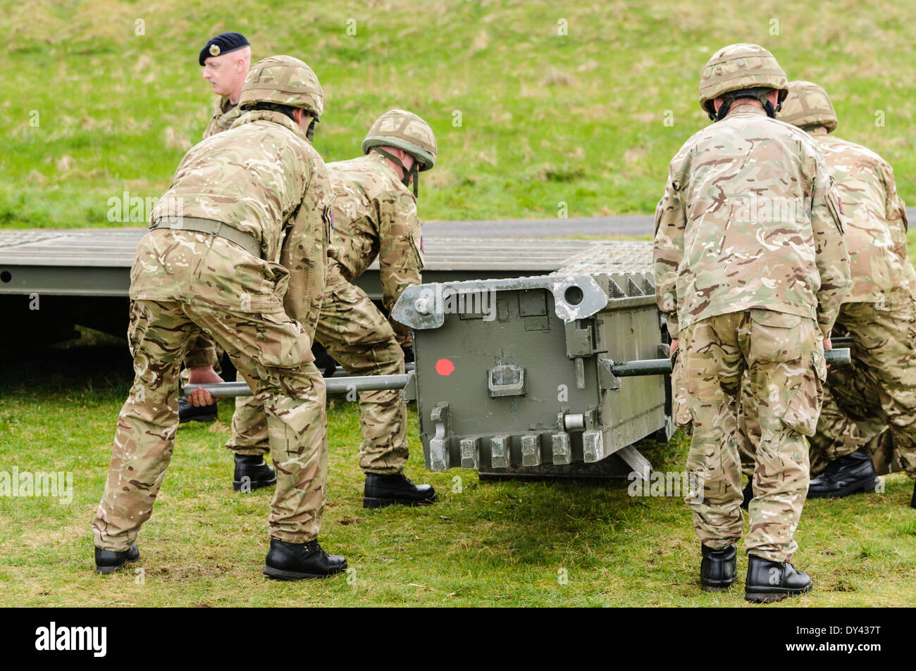 Soldiers from the Royal Engineers assemble a mobile bridge Stock Photo