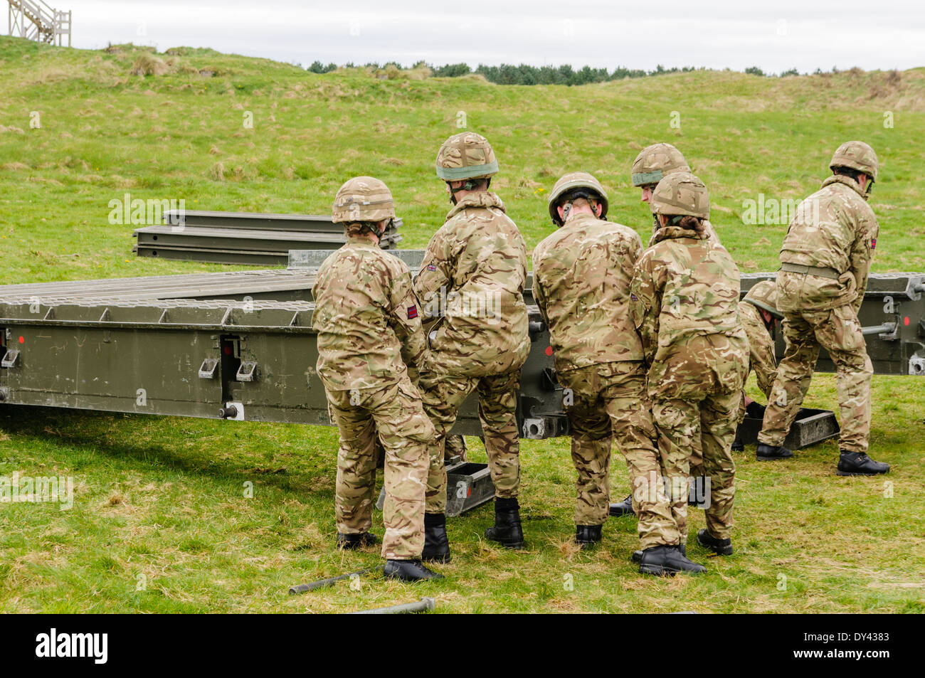 Soldiers from the Royal Engineers assemble a mobile bridge Stock Photo