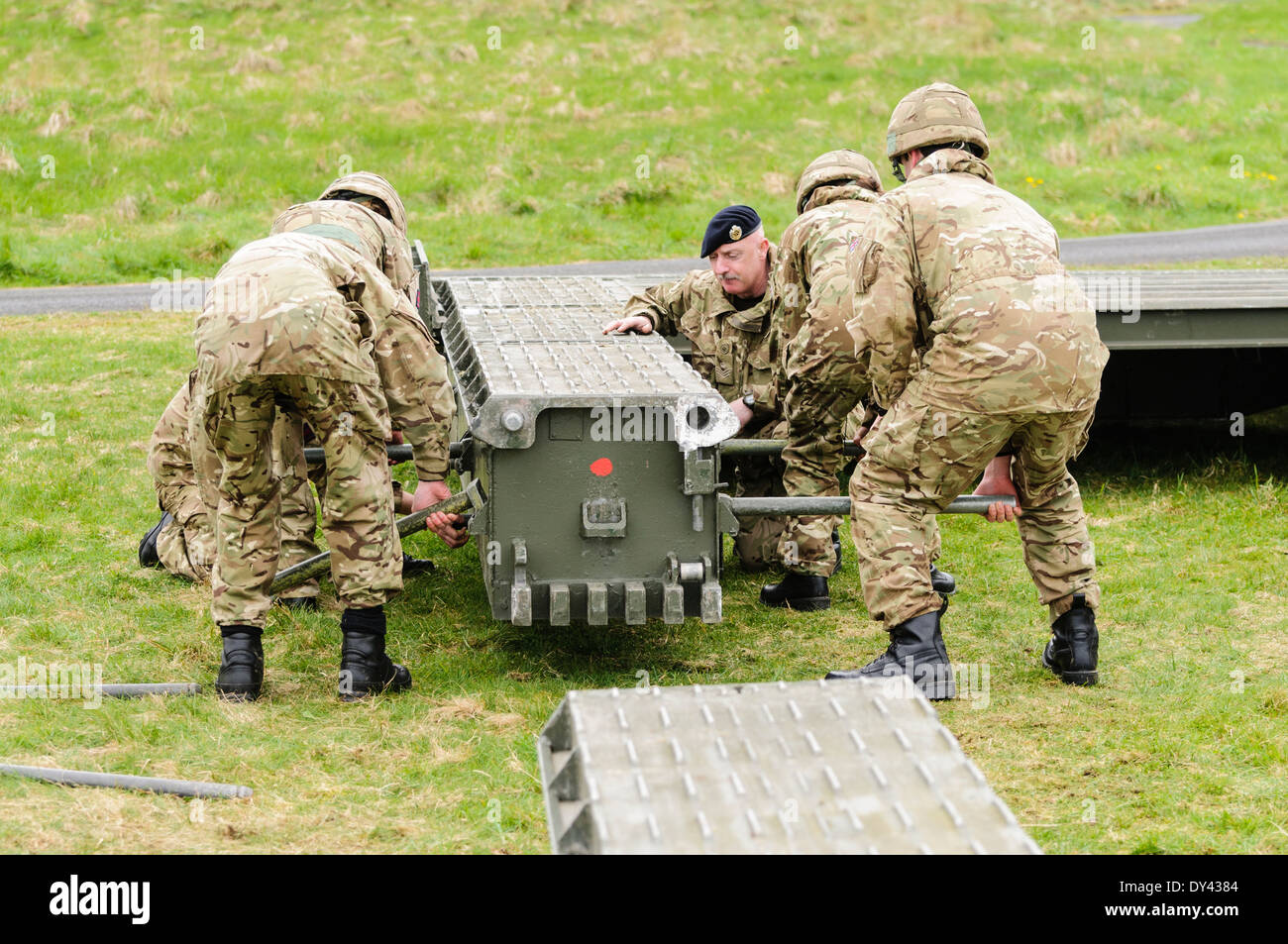 Soldiers from the Royal Engineers assemble a mobile bridge Stock Photo