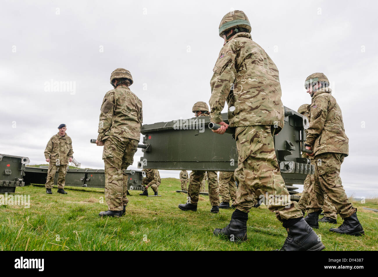 Soldiers from the Royal Engineers assemble a mobile bridge Stock Photo