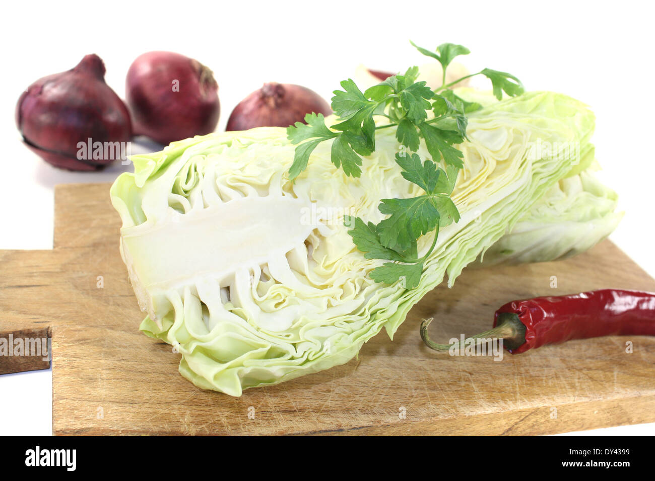 sweetheart Cabbage with board on a light background Stock Photo