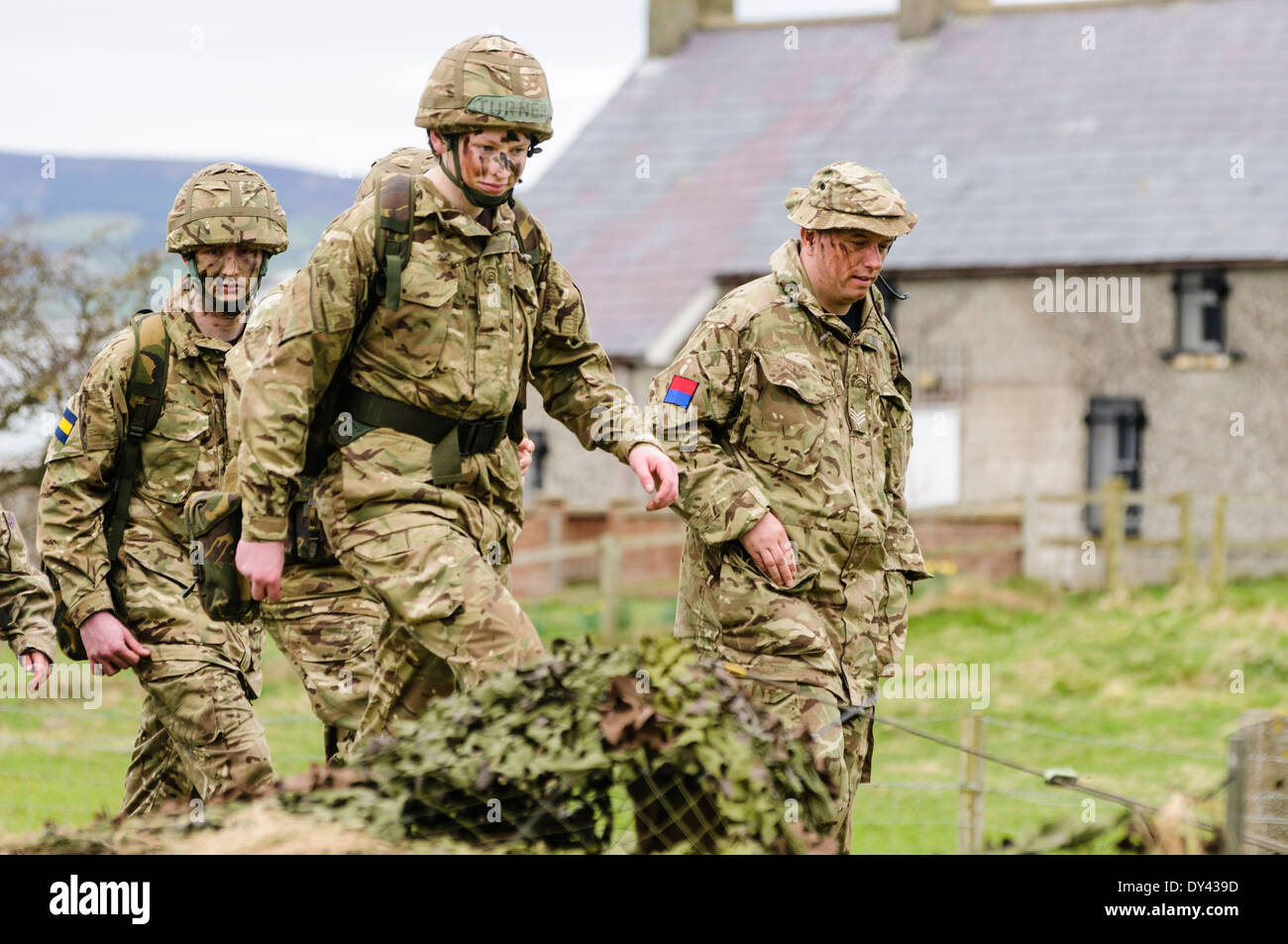 Soldiers enter a forward observation post in a rural location of Northern Ireland Stock Photo