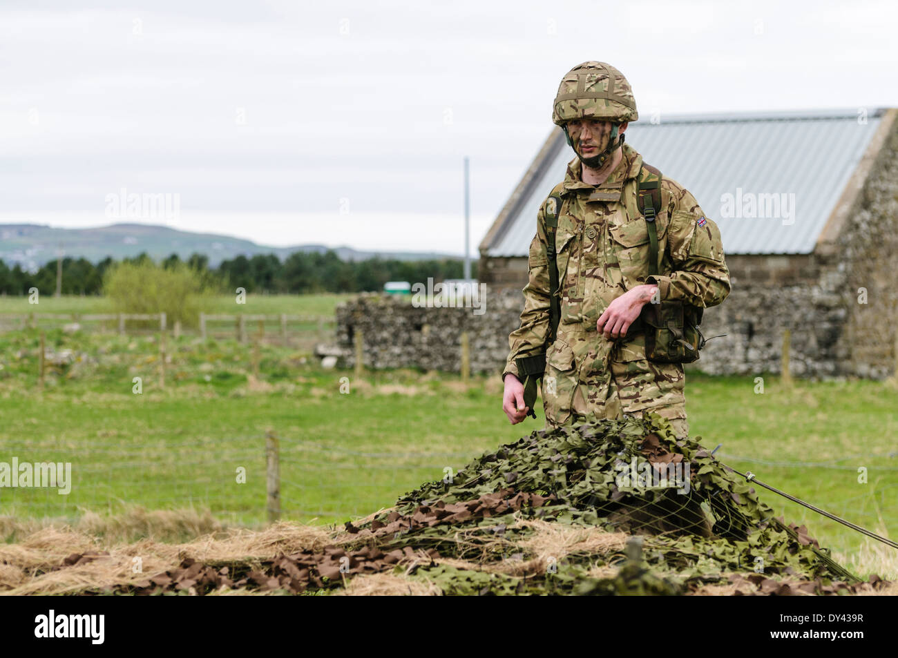A soldier enters a forward observation post in a rural location of Northern Ireland Stock Photo