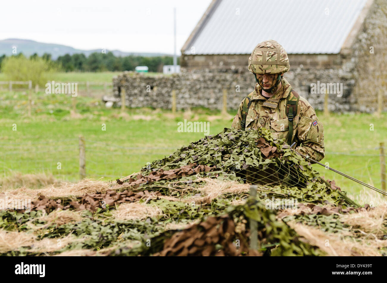 A soldier enters a forward observation post in a rural location of Northern Ireland Stock Photo