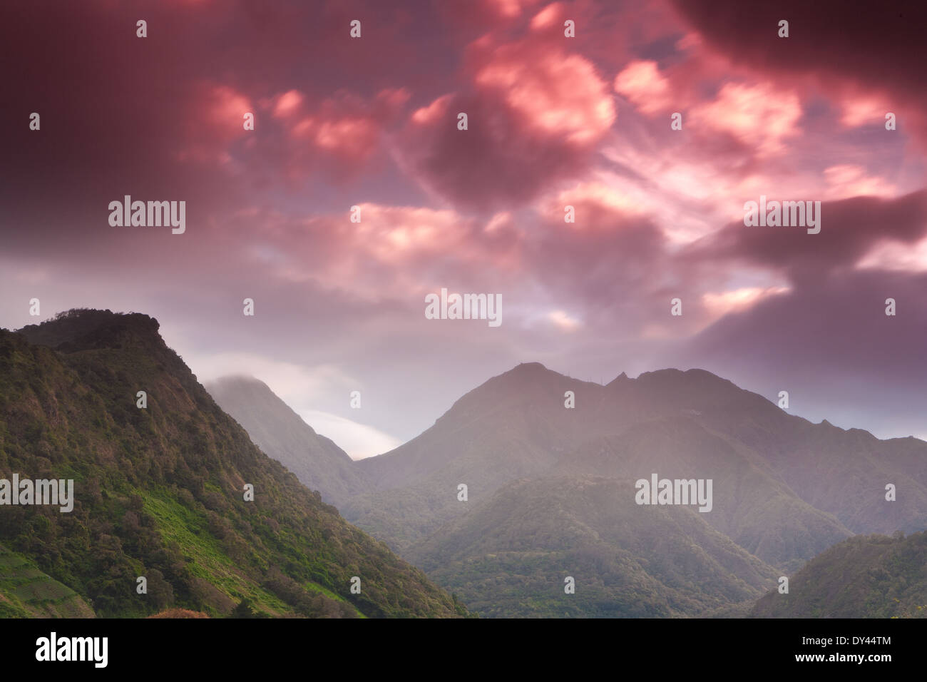 Colourful skies at sunrise and rainfall over Volcan Baru, 3475 m, in the Volcan Baru national park, Chiriqui province, Republic of Panama. Stock Photo