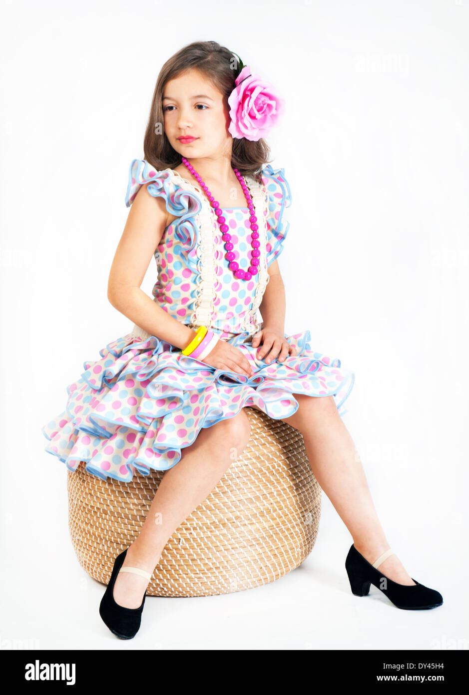 Beautiful girl in national dress dancing flamenco Stock Photo