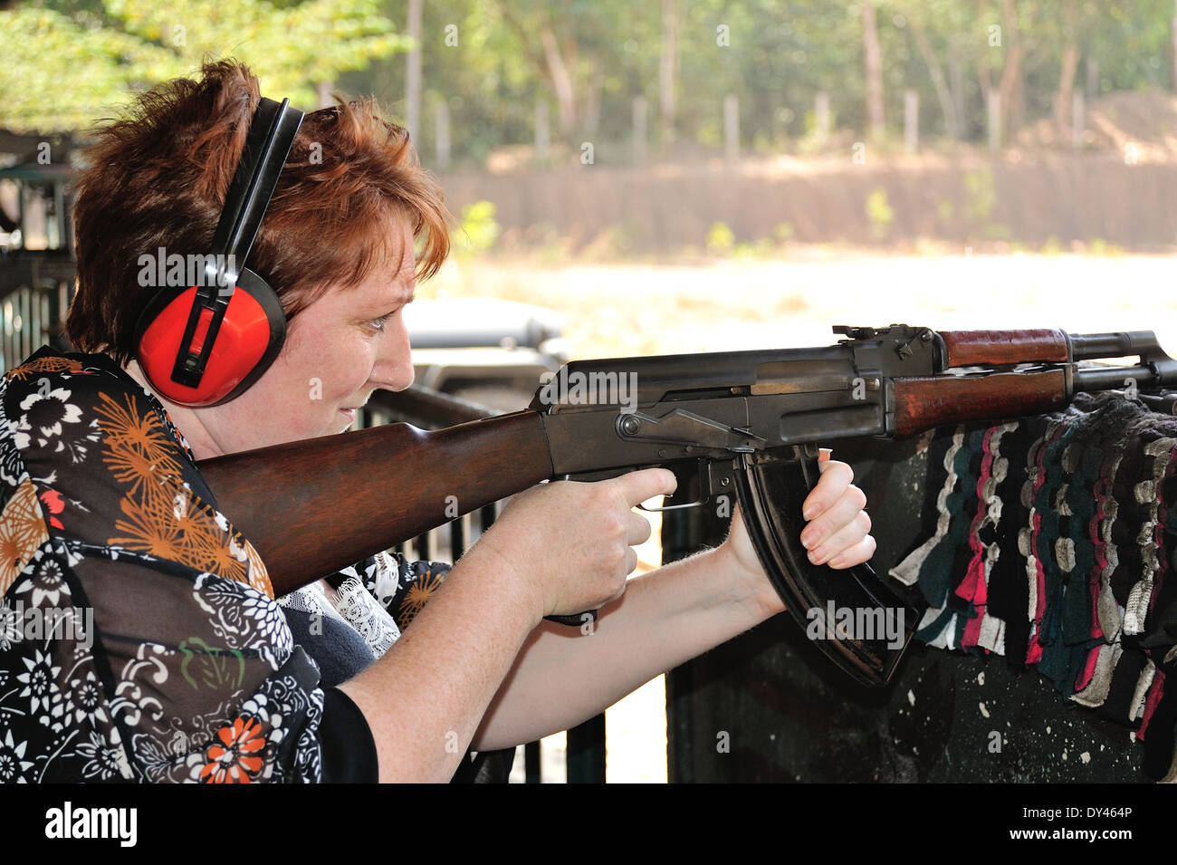 Woman shooting AK47 gun Chu Chi tunnels Saigon Vietnam Stock Photo Alamy