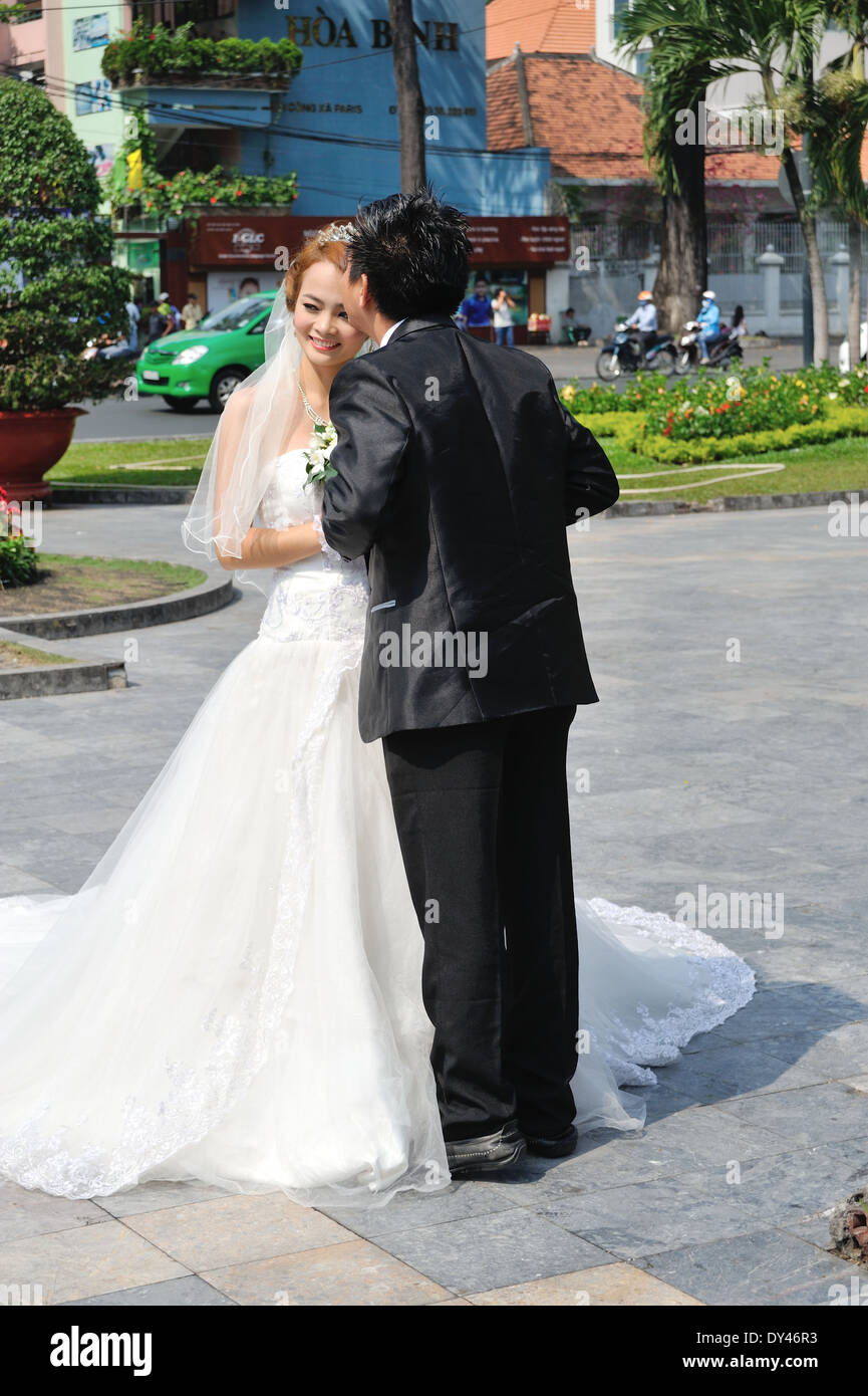 Wedding photos outside Notre Dame Cathedral and Central Post Office Saigon Vietnam Stock Photo