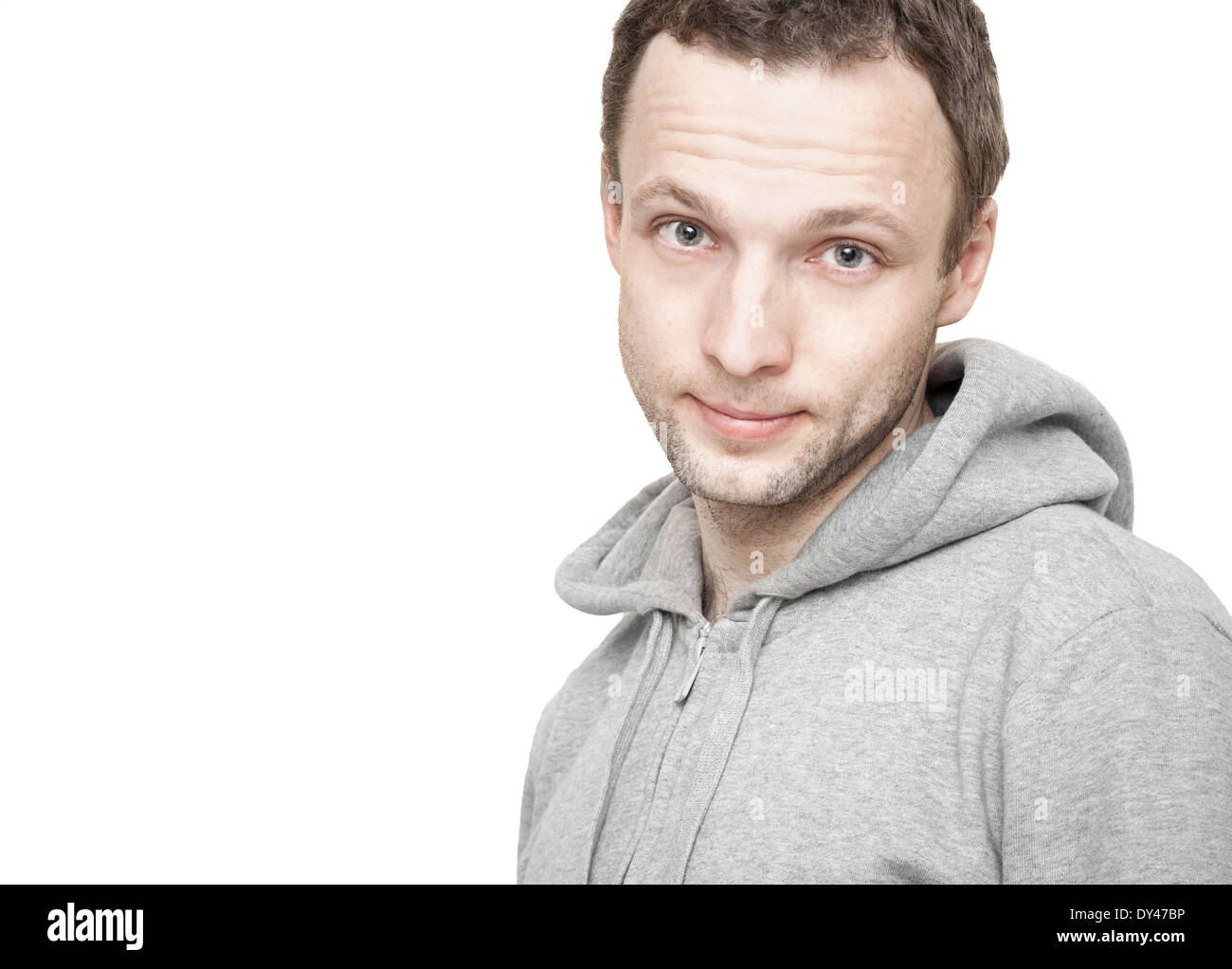Young Caucasian man in gray sports jacket with hood. Studio portrait isolated on white Stock Photo