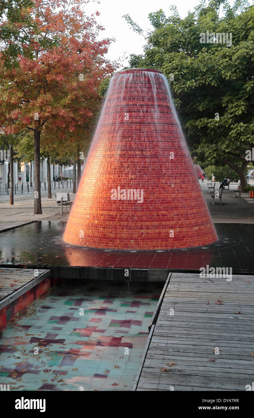 Unusual red cone shaped fountain in the Parque das Nações area of Lisbon, (Lisboa), Portugal. Stock Photo