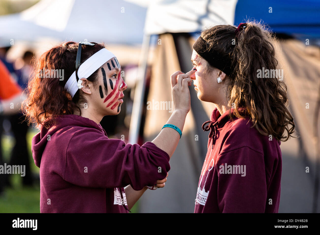 Players apply face paint as they get ready for the 7th Annual Quidditch
