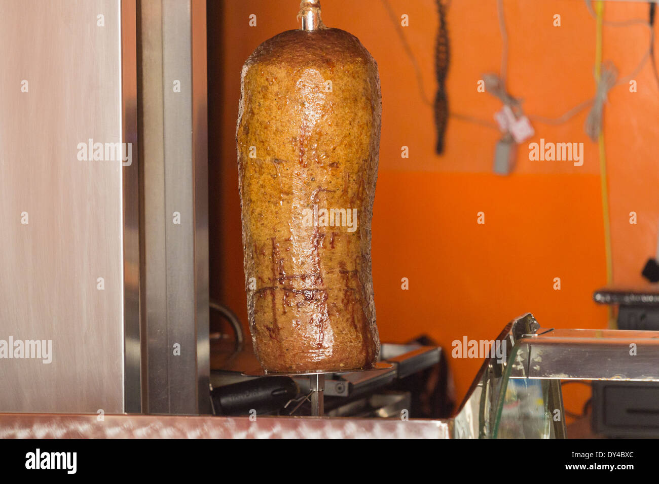 Doner kebap being grilled in a street shop Stock Photo