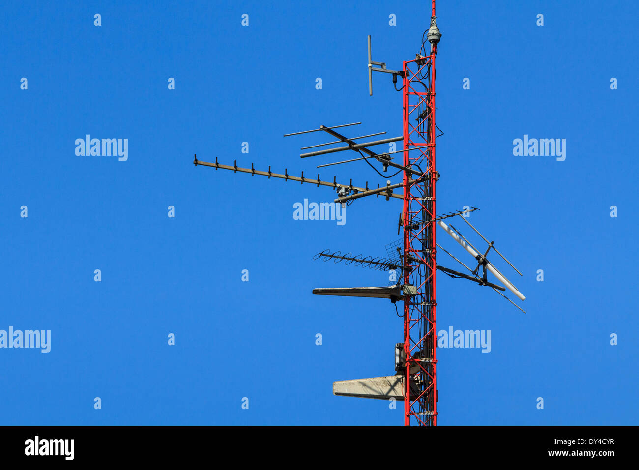 A broadcast antenna for tv and cell phone on blue sky Stock Photo Alamy