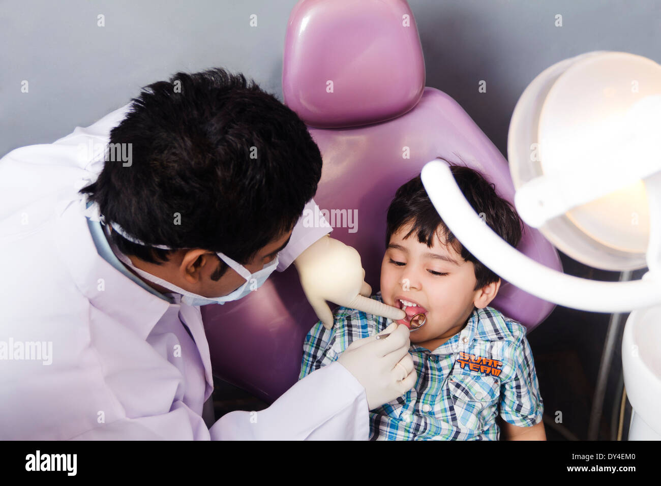 Indian Dentist Checking Teeth Stock Photo