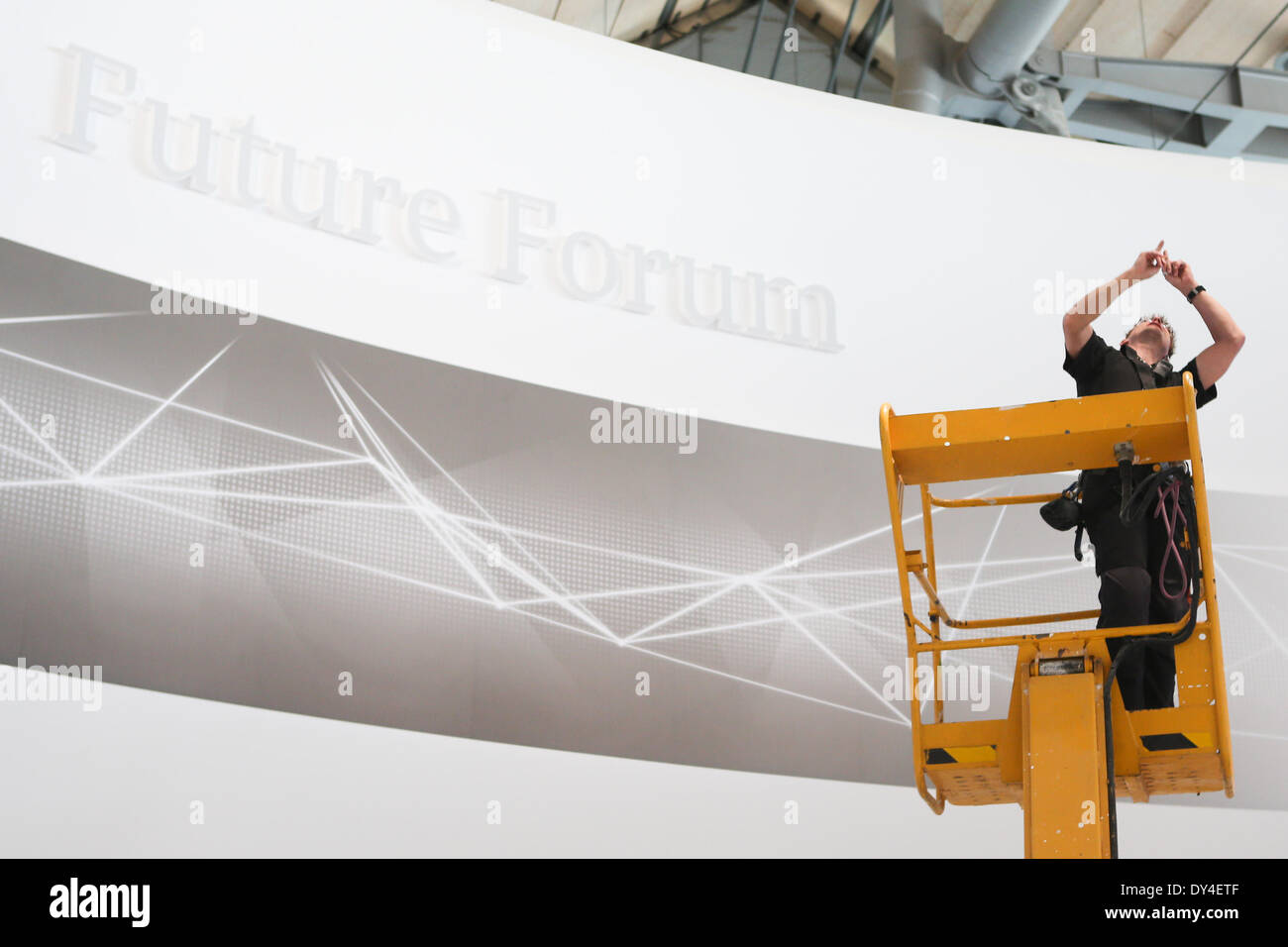 Hanover, Germany. 6th Apr, 2014. A worker works at an Siemens' stand of 2014 Hanover Industrial Trade Fair in Hanover, Germany, on Apr. 6, 2014. The fair will run from April 7 to 11 with Holland as its partner country. © Zhang Fan/Xinhua/Alamy Live News Stock Photo