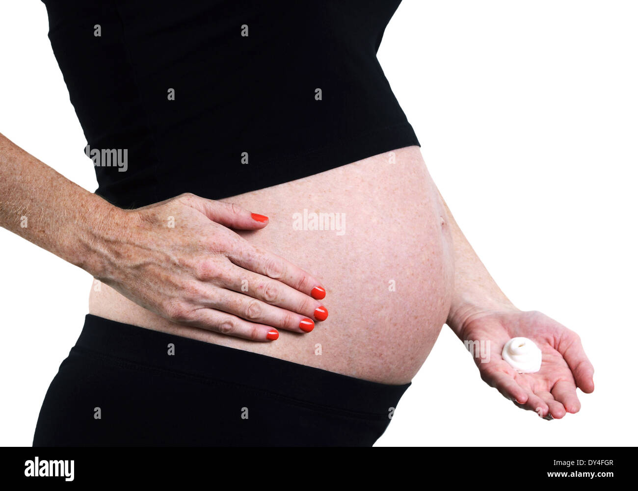 putting cocoa butter lotion on pregnant belly to reduce risk of stretch