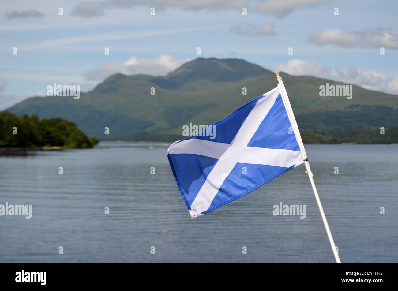 The Scottish flag with Loch Lomond in the background Stock Photo