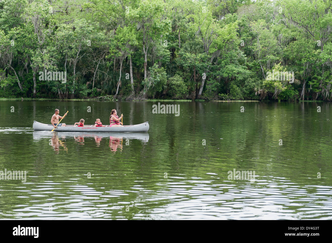 A family of four canoing at Deleon Springs State Park, Florida USA Stock Photo