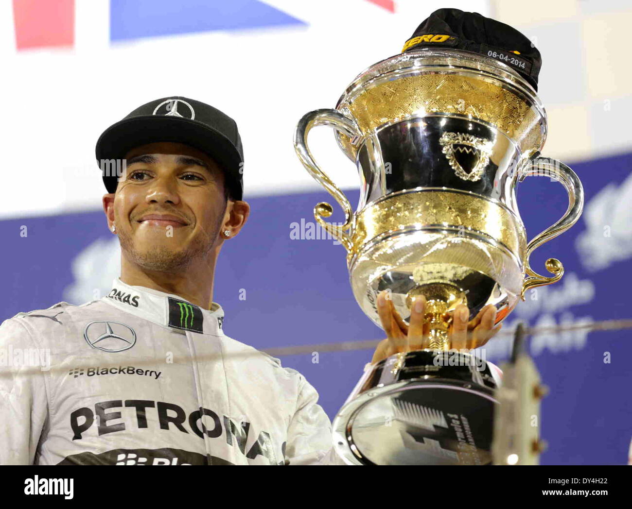 Manama, Bahrain. 06th Apr, 2014. Mercedes' Lewis Hamilton celebrates after the final of Formula 1 Bahrain Grand Prix in Manama, Bahrain, on April 6, 2014. Hamilton won the title with 1 hour 39 minutes and 42.743 seconds.  Credit:  Hasan Jamali/Xinhua/Alamy Live News Stock Photo