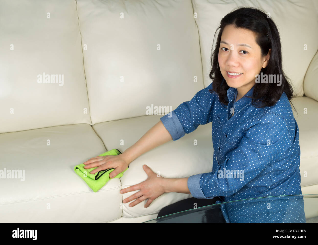 Horizontal Photo Of Mature Woman Looking Forward Cleaning White