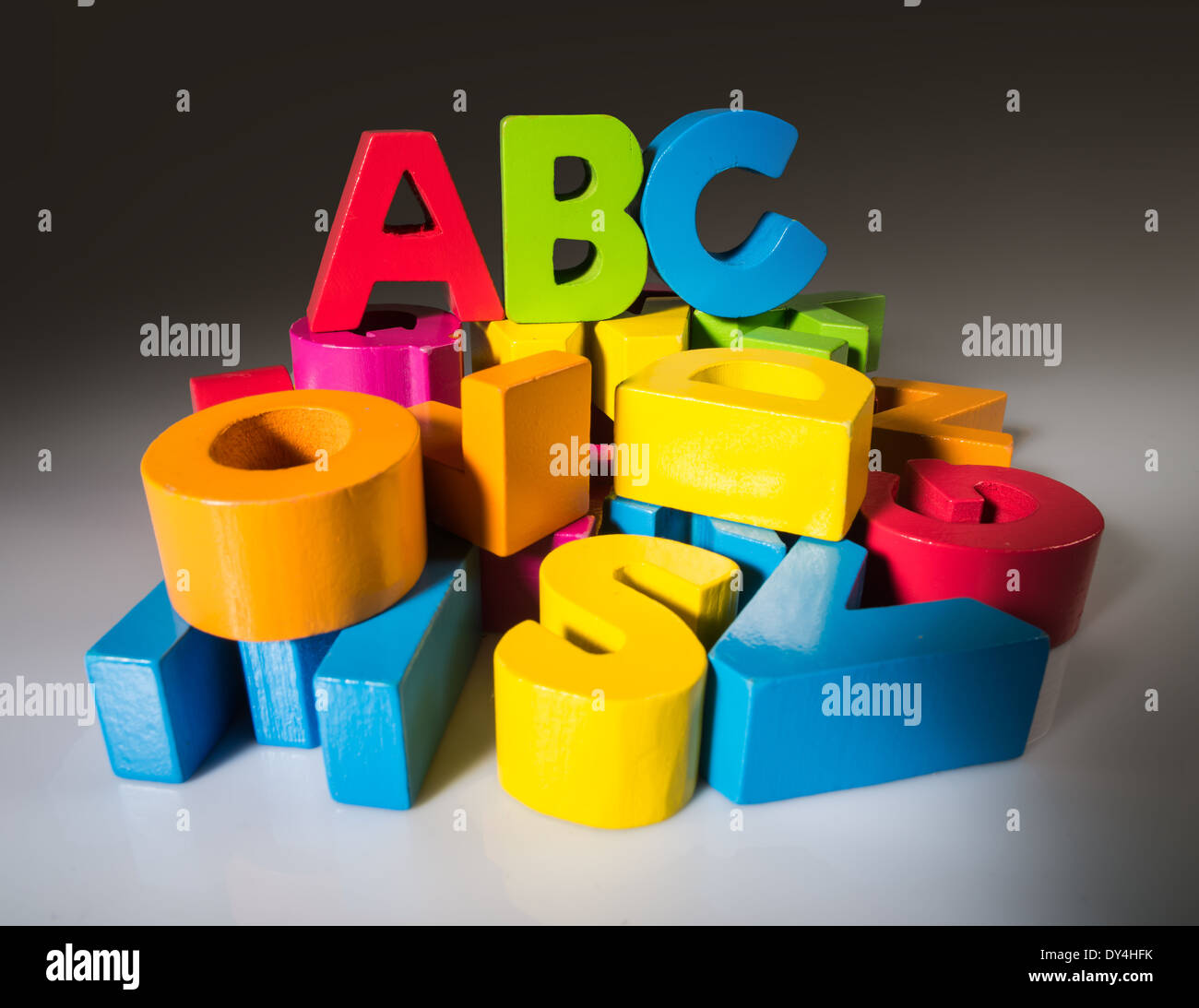 Multicolored letters A B C made of wood. Stock Photo