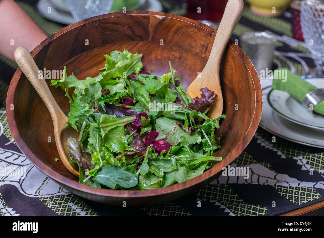 Fresh organic salad at a dinner table. Stock Photo