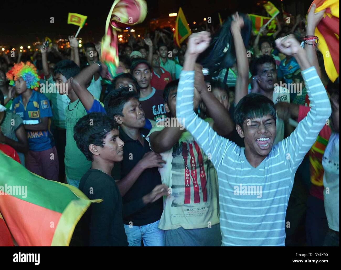 Colombo, Sri Lanka. 6th Apr, 2014. Fans of Sri Lanka celebrate in the street after their team won the ICC Twenty20 World Cup cricket final against India, in Colombo, capital of Sri Lanka, April 6, 2014. Credit:  Pushpika Karunaratne/Xinhua/Alamy Live News Stock Photo
