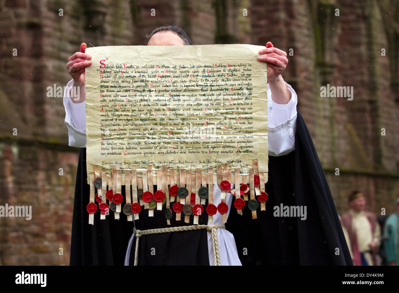 Arbroath, Scotland, UK 6th April, 2014.  Performers and re-enactors, holding the scroll, a letter in Latin submitted to Pope John XXII, dated 6 April 1320, sealed by fifty-one magnates and nobles, intended to confirm Scotland's status as an independent, sovereign state at the Scottish Homecoming event.  'The Declaration of Arbroath' held at Arboath Abbey where the Nobles of Scotland, assembled in the ruins of Arbroath Abbey to commemorate the signing of the Declaration of Arbroath giving Scotland independence in 1320. Stock Photo