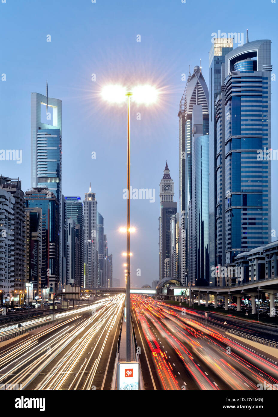 Dusk view of traffic and skyscrapers along Sheikh Zayed Road in Dubai United Arab Emirates Stock Photo