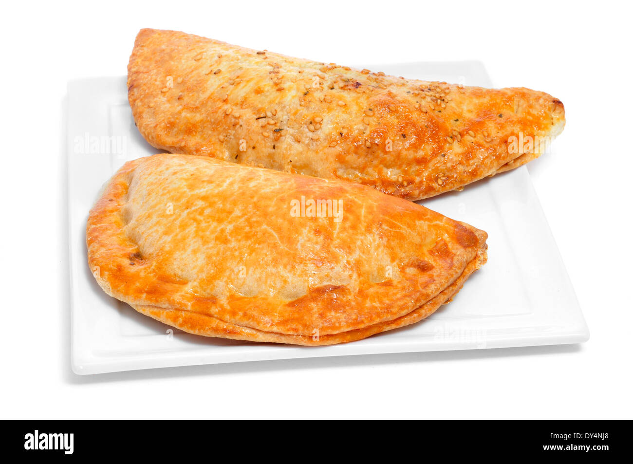 a plate with some different empanadas argentinas, typical argentine stuffed pastries, on a white background Stock Photo