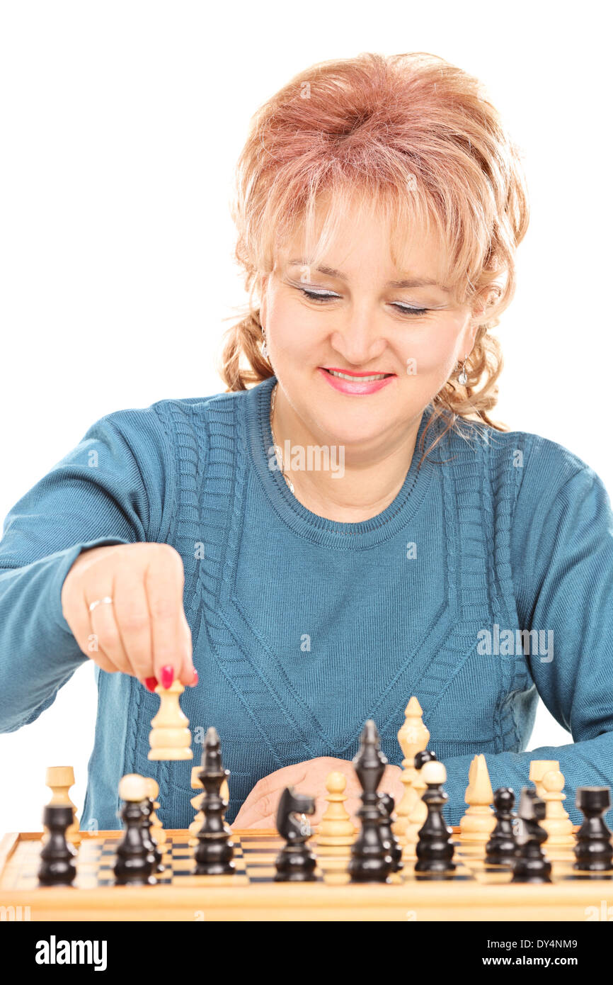 Mature woman playing chess Stock Photo