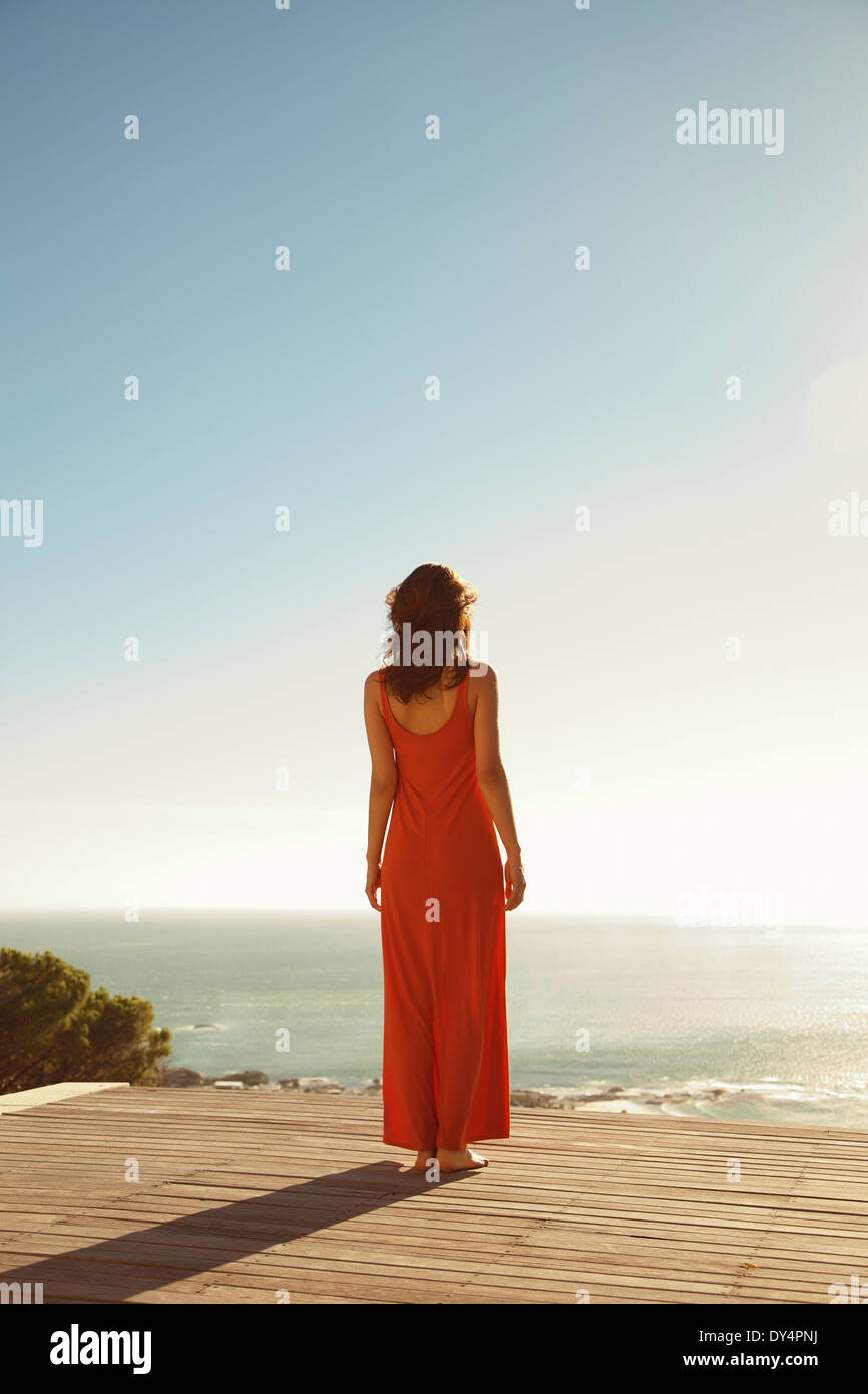Back View of Woman Looking at the Ocean Stock Photo