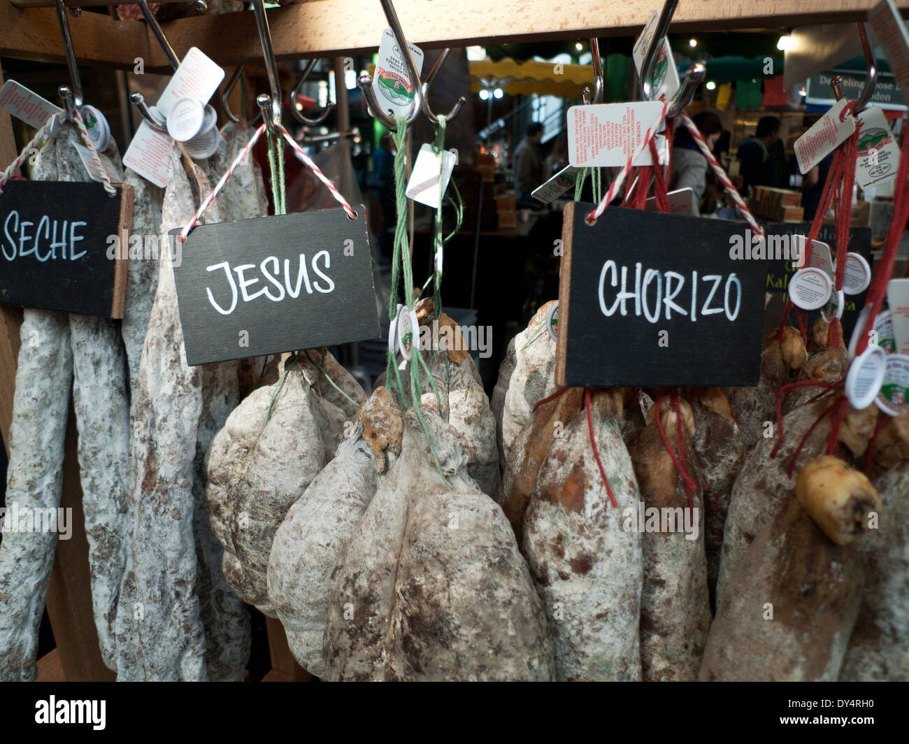 Dried cured sausage and chorizo hanging on a stall in Borough Market, London Bridge, London, UK  KATHY DEWITT Stock Photo