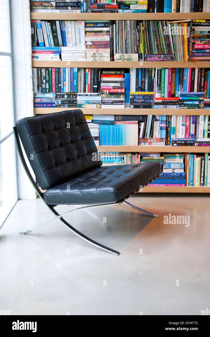Bookcase and Leather Easy Chair Stock Photo