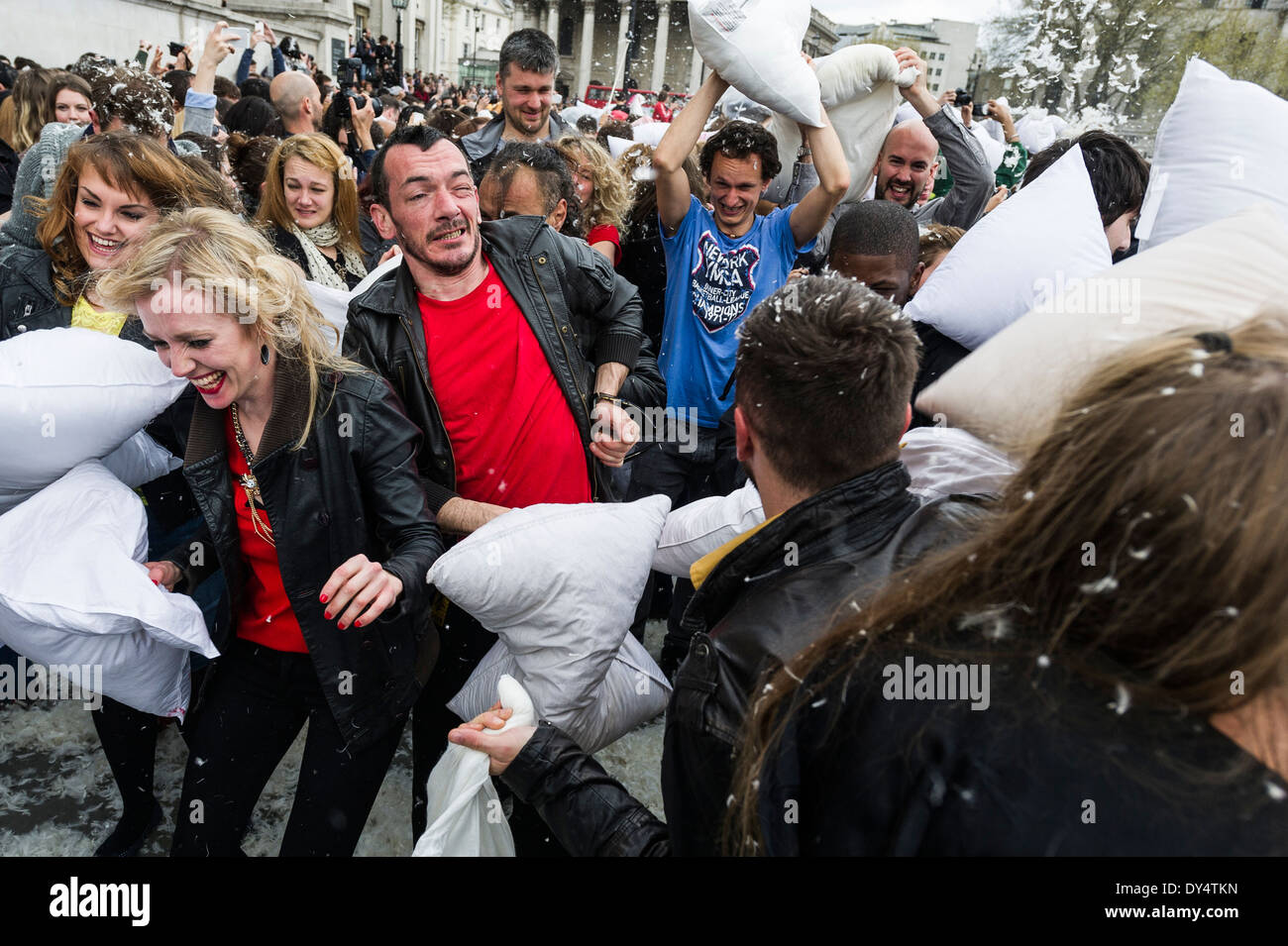 People gathering to participate in the International Pillow Fight Day in Trafalgar square in London. Stock Photo
