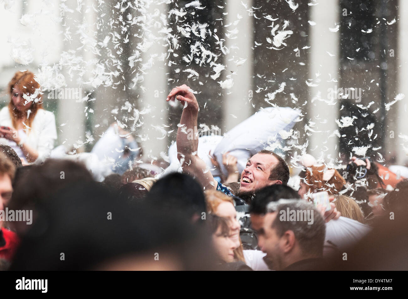 People gathering in Trafalgar Square to participate in the International Pillow Fight Day. Stock Photo