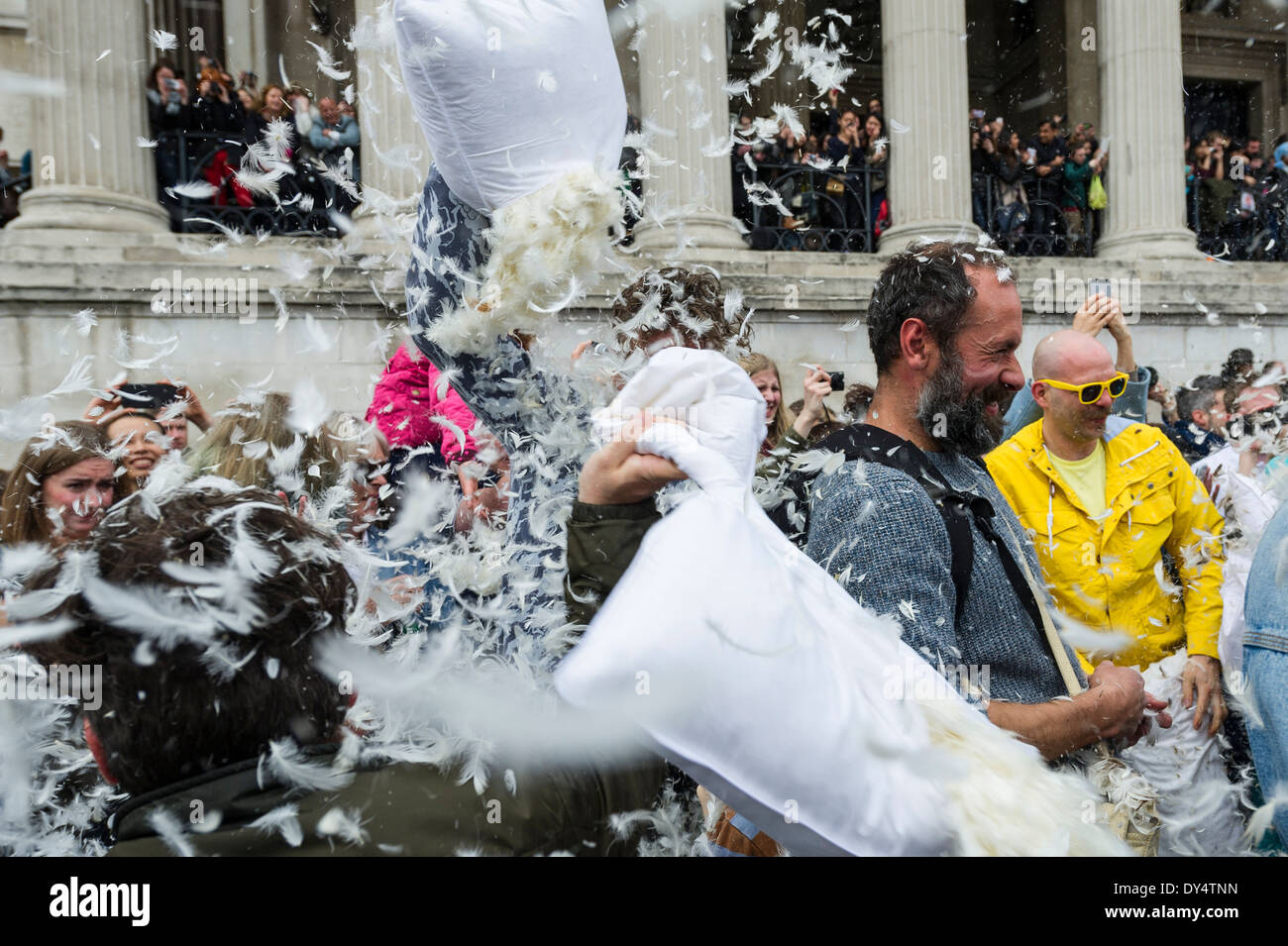 People gathering to participate in the International Pillow Fight Day in Trafalgar Square in London. Stock Photo