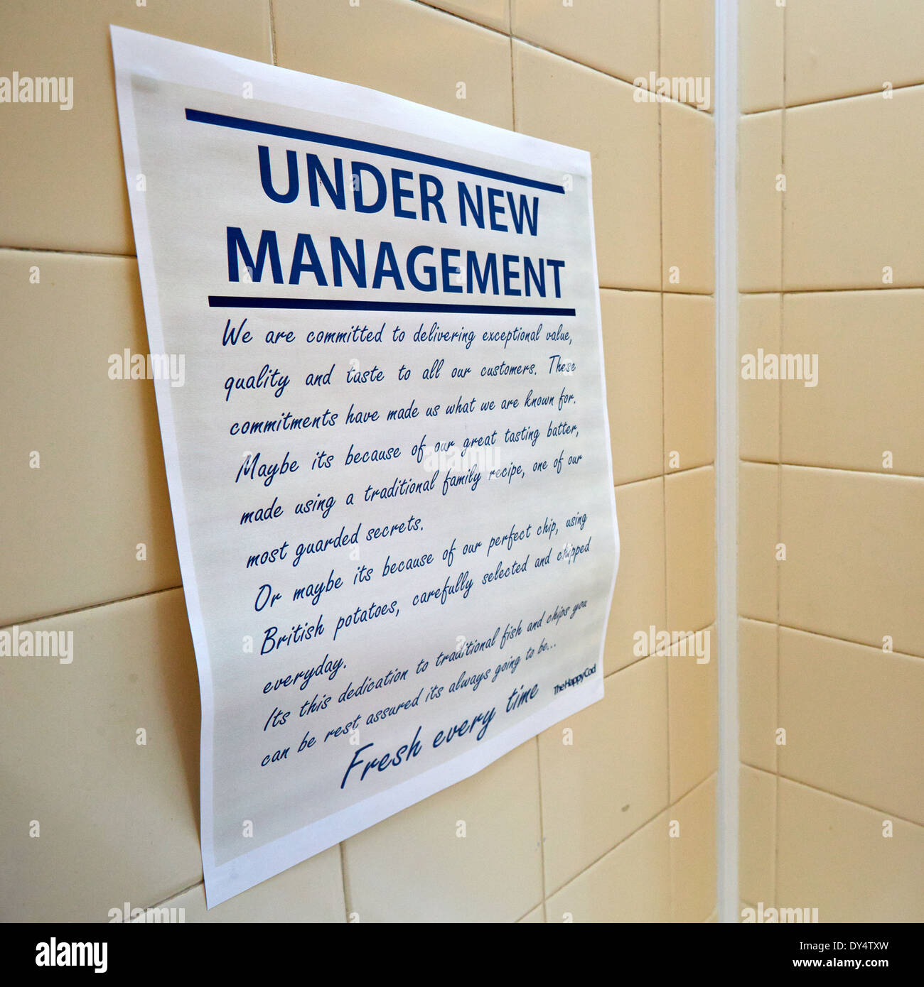 Sign reading under new management in a fish and chip shop Stock Photo