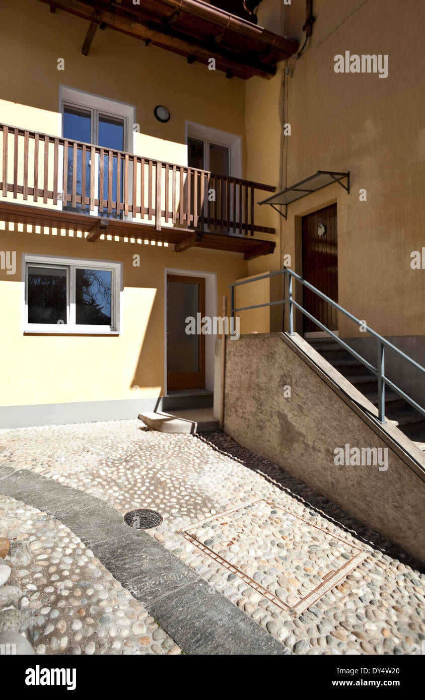 courtyard of a renovated house in the village Stock Photo