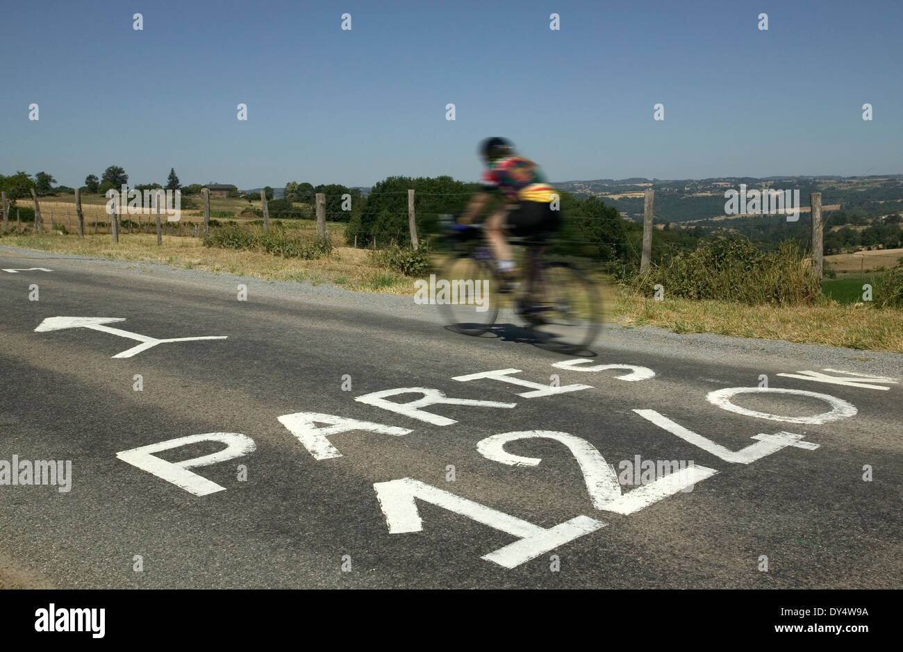 2004 Tour de France St-Flour Stage 11 rider crossing road grafitti. Stock Photo