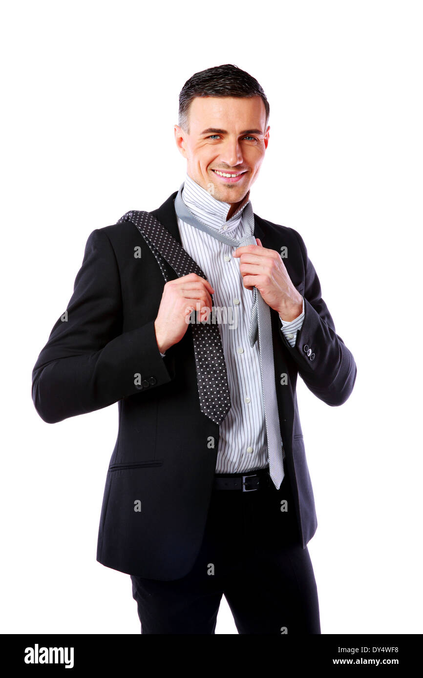 Happy businessman wonders which necktie to choose Stock Photo