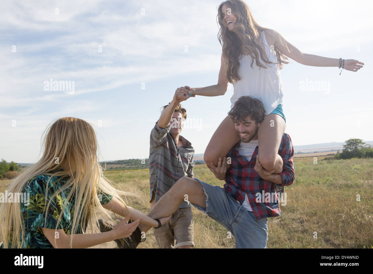 Man shoulder carrying woman hi-res stock photography and images - Alamy