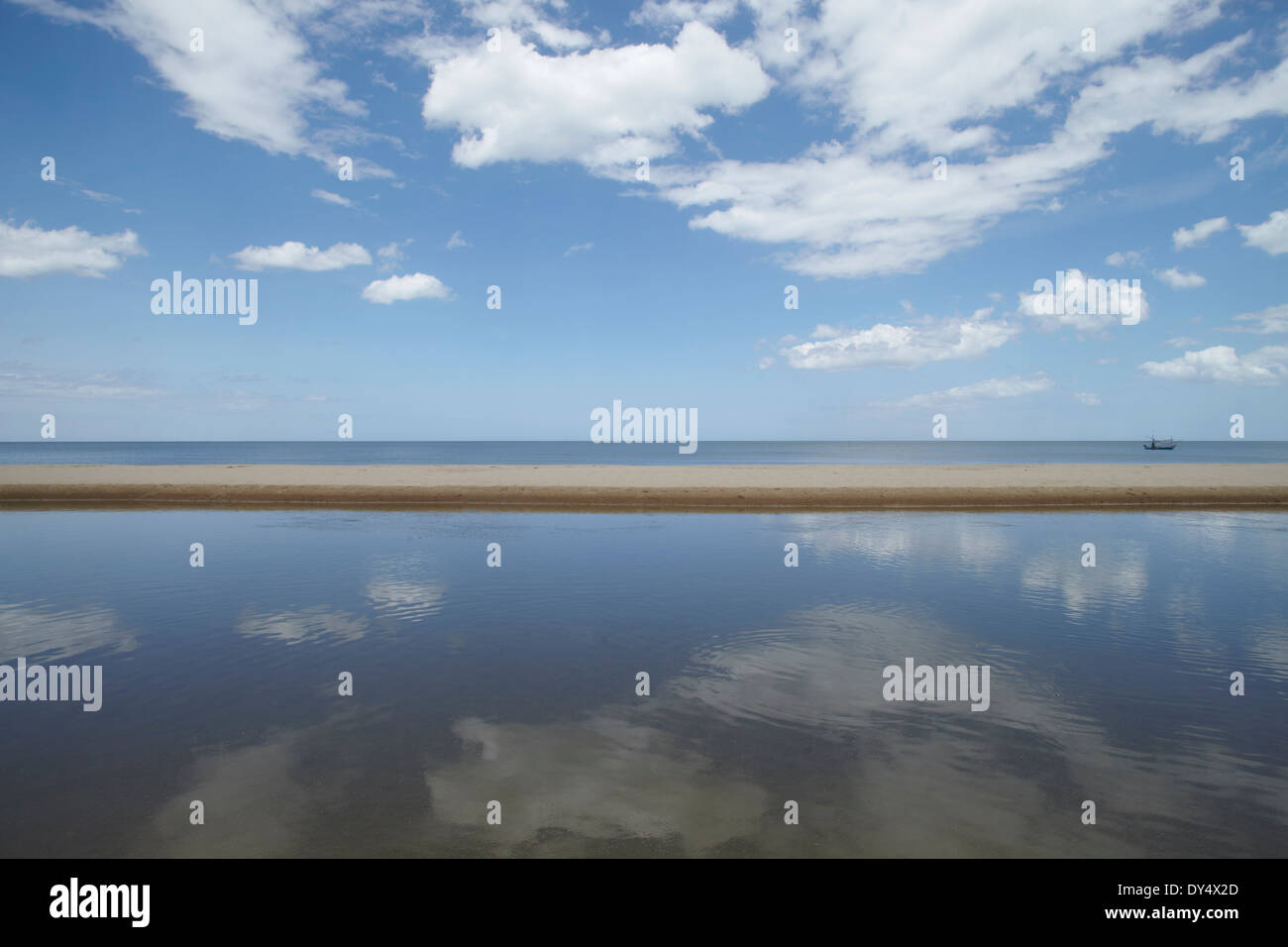 Cloudy blue skies and ocean, Hua Hin, Thailand Stock Photo