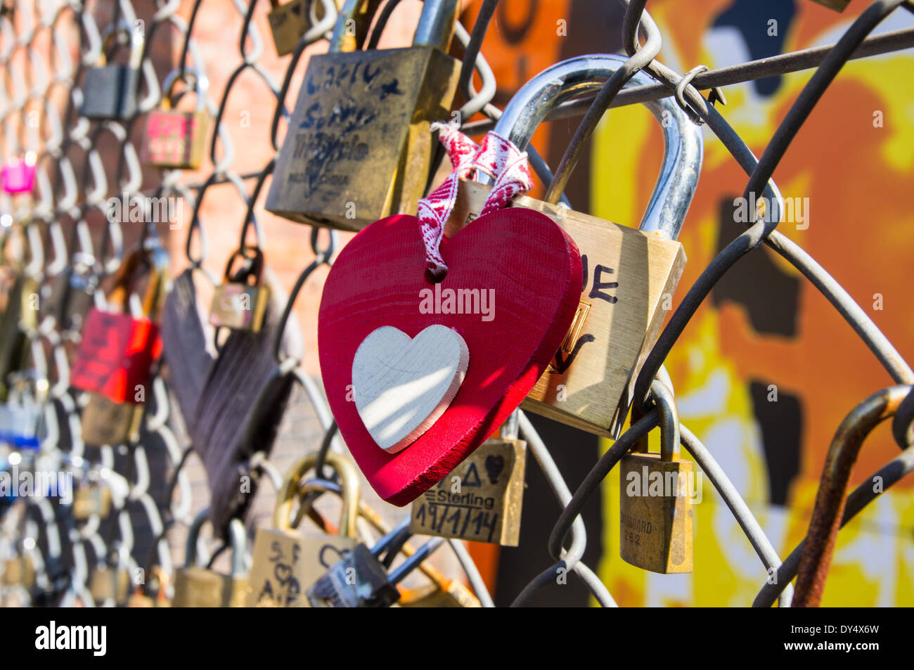 Padlocks left by couples on the fence Stock Photo
