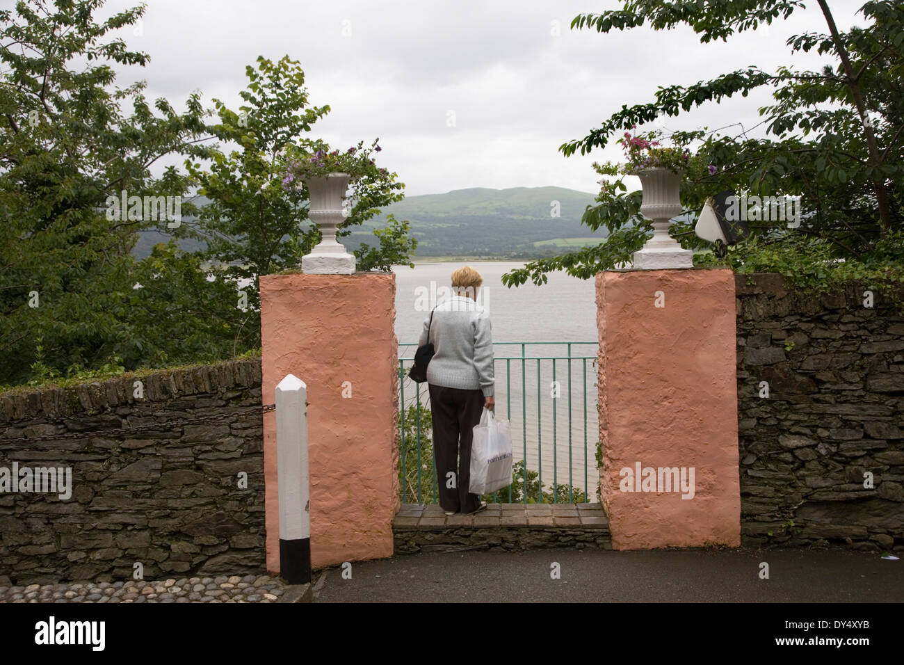 Woman looking out to sea. Portmeirion, Wales, United Kingdom Stock Photo