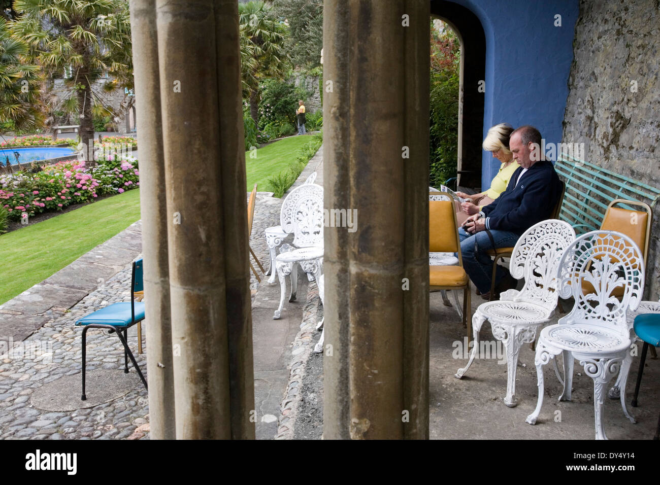 Couple sitting inside Colonnade, ornamental gardens Portmeirion, Wales, United Kingdom Stock Photo
