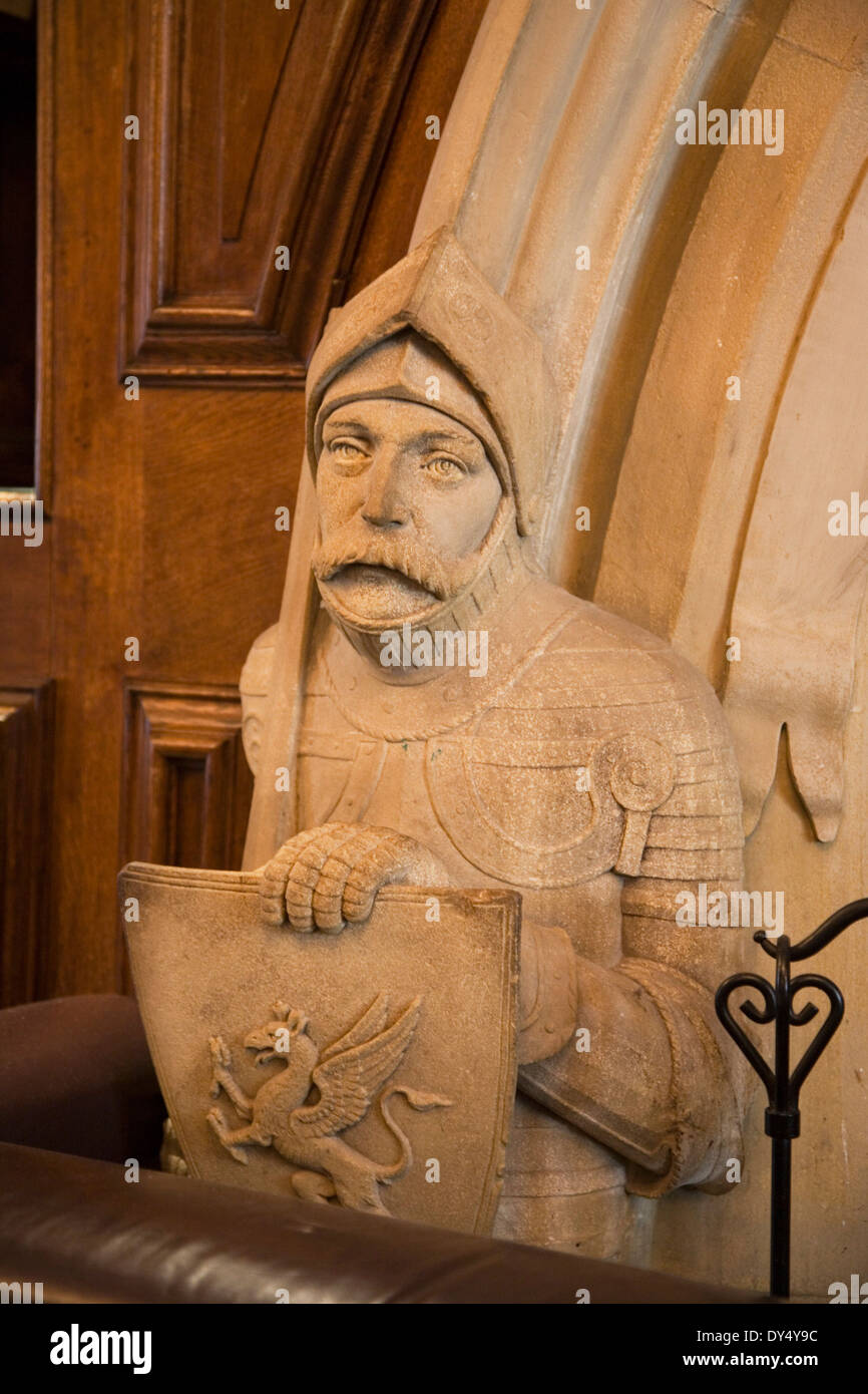 Portmeirion hotel with carved stone knight at fireplace. Portmeirion, North Wales, United Kingdom Stock Photo