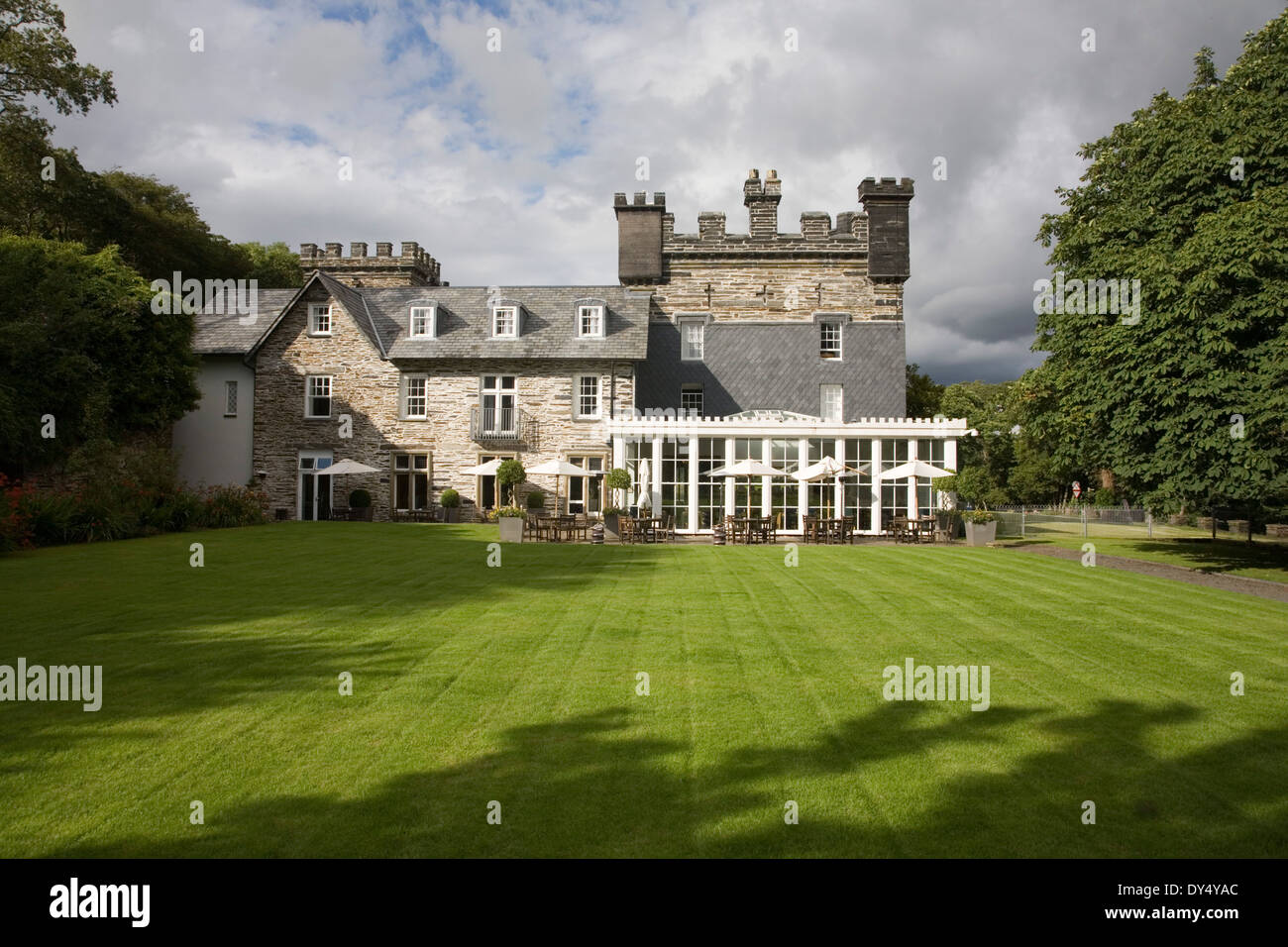 Portmeirion Castle hotel restaurant and lawn garden. Portmeirion, North Wales, United Kingdom Stock Photo