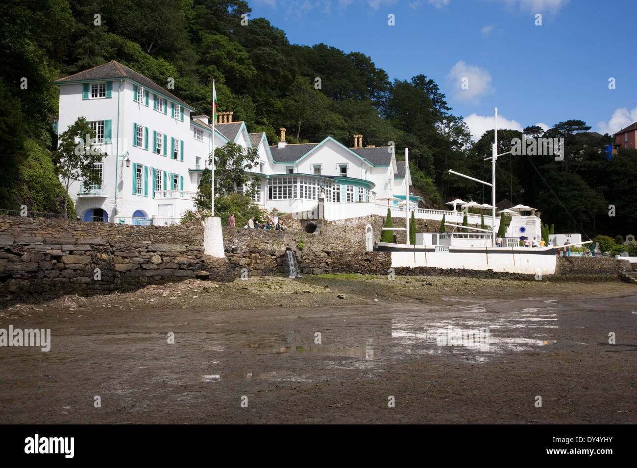 Portmeirion hotel restaurant estuary at low tide with boat. Portmeirion, North Wales, United Kingdom Stock Photo